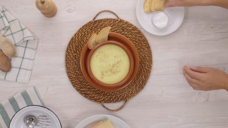 Plate of Italian Fonduta Served with A Variety of Ingredients Arranged Around It