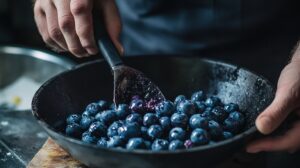 Gently fold in the blueberries and lemon zest (if using), ensuring the blueberries are evenly distributed throughout the batter.